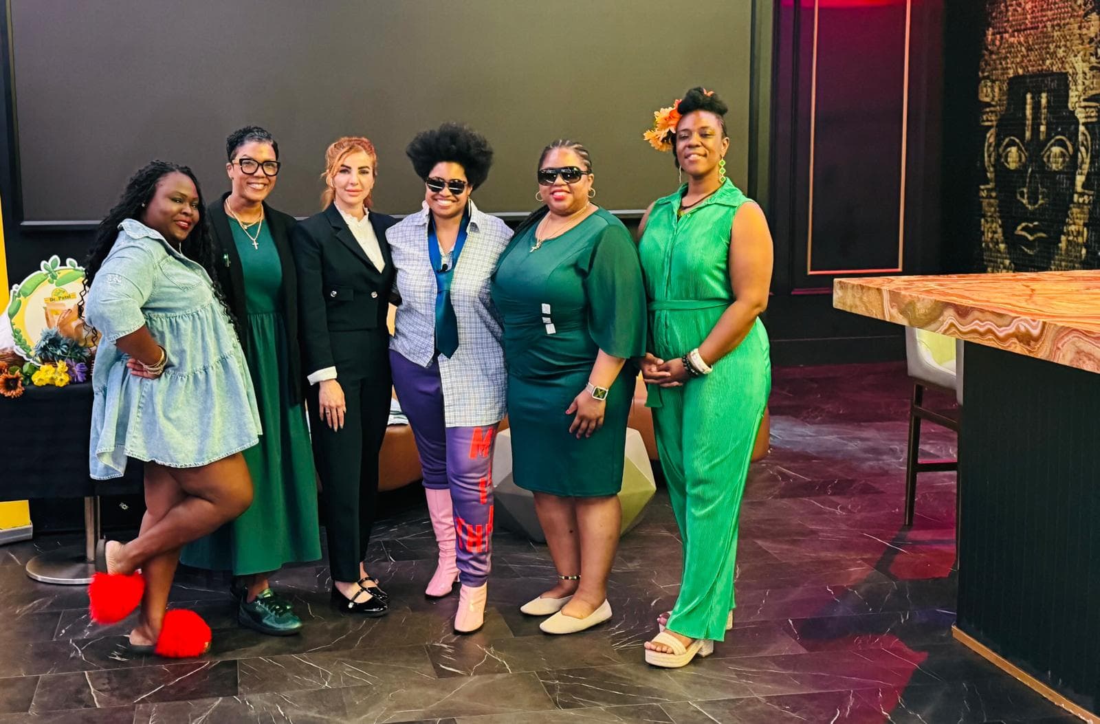 Caleesis Telesh with fellow speakers at a women’s initiative program